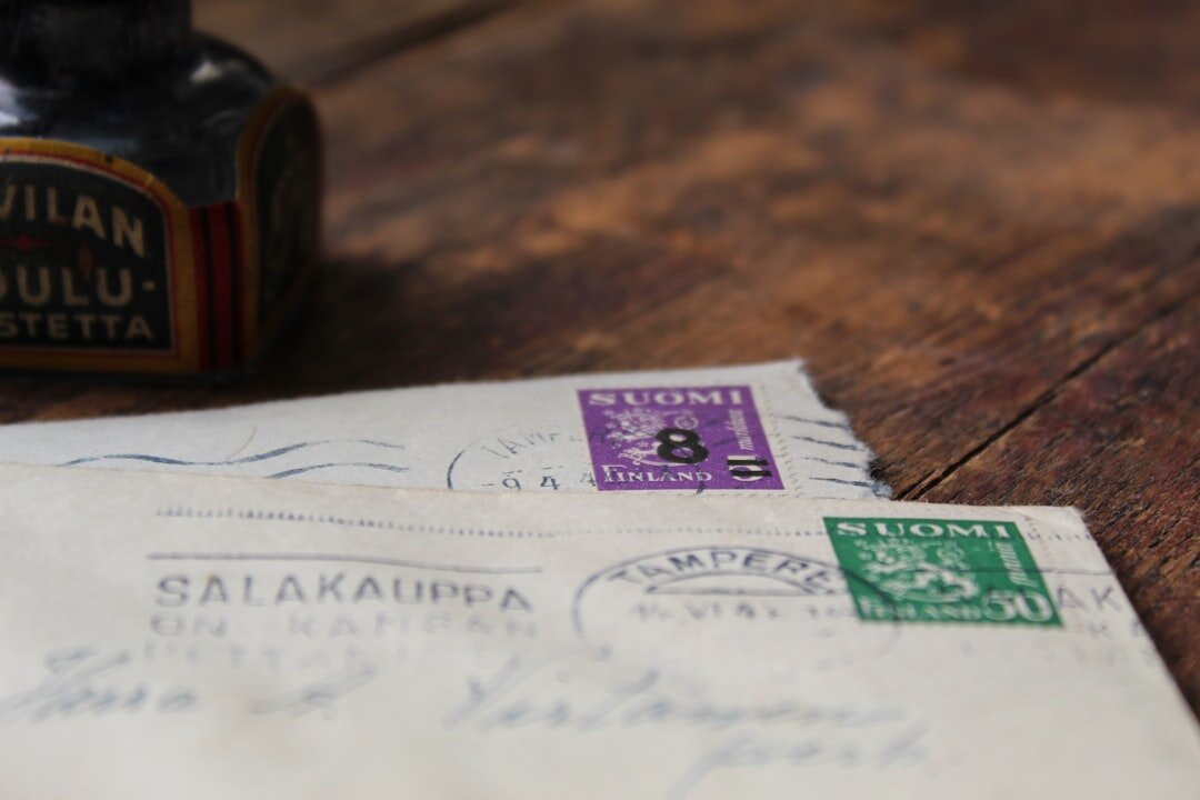 old handwritten letters on wooden table