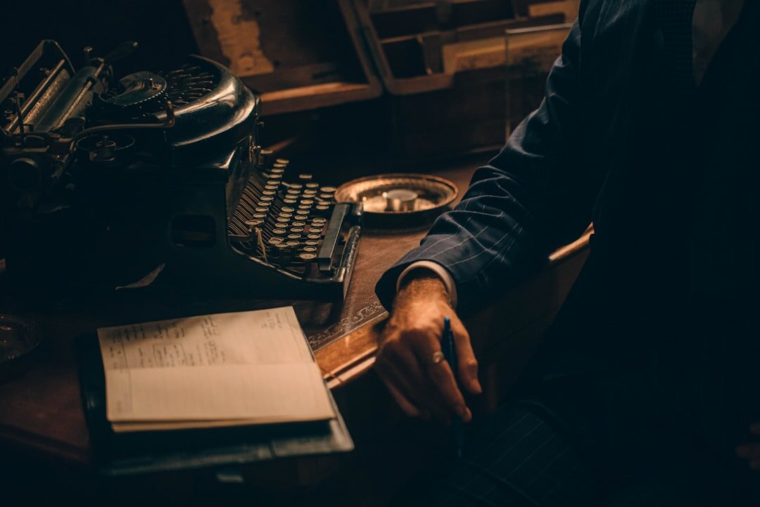 writer typing in dim light
